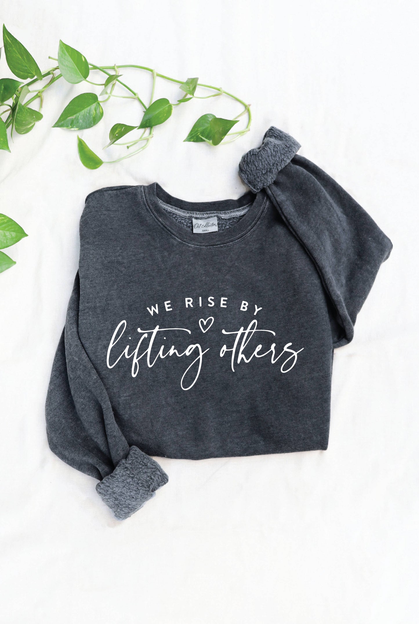 WE RISE BY LIFTING OTHERS Mineral Graphic Sweatshirt