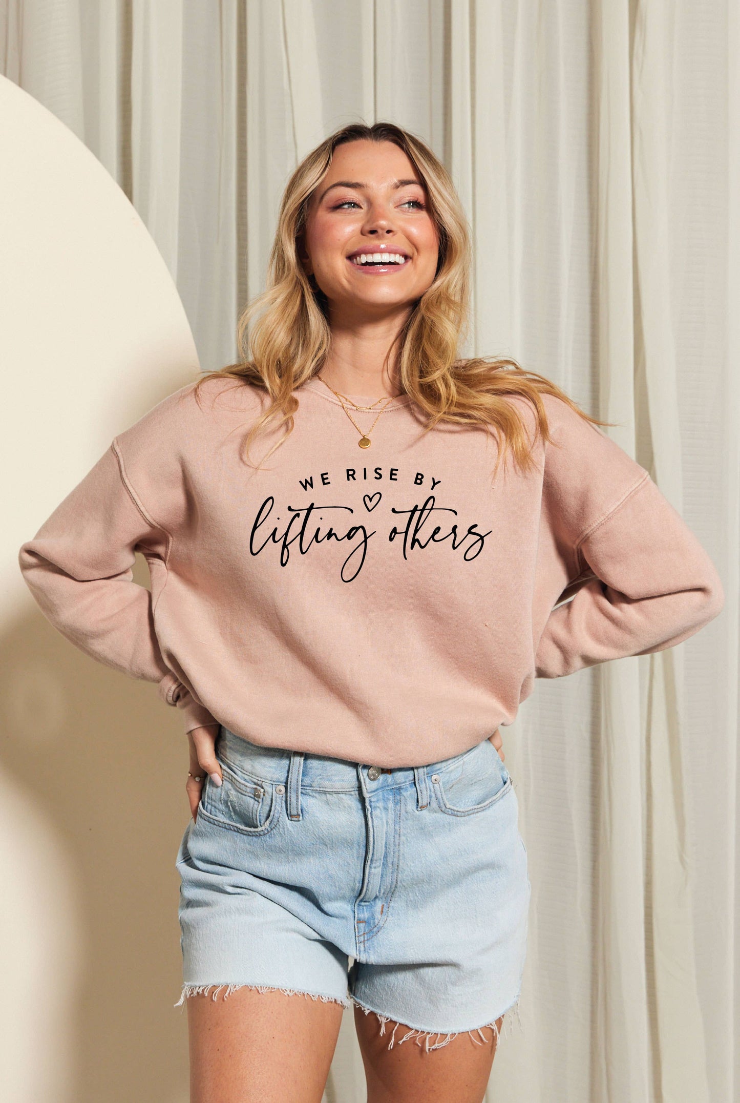 WE RISE BY LIFTING OTHERS Mineral Graphic Sweatshirt