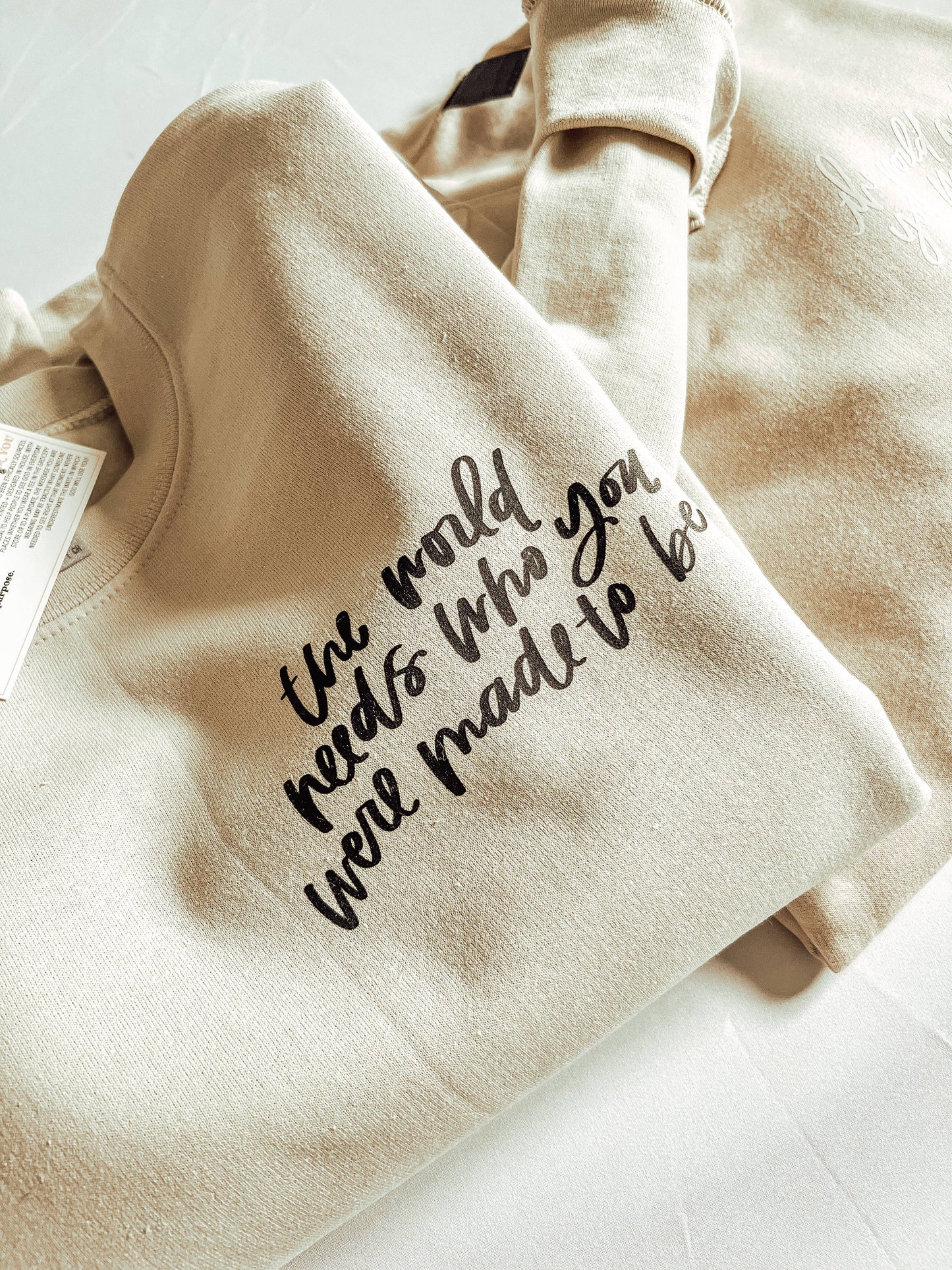 The World Needs Sweatshirt