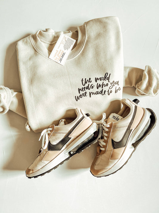 The World Needs Sweatshirt