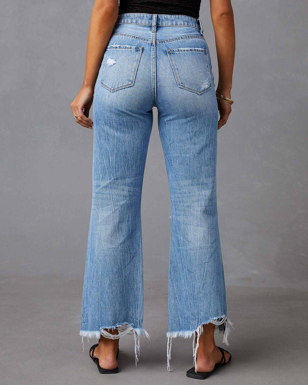 Wide-leg ripped cropped fringed jeans